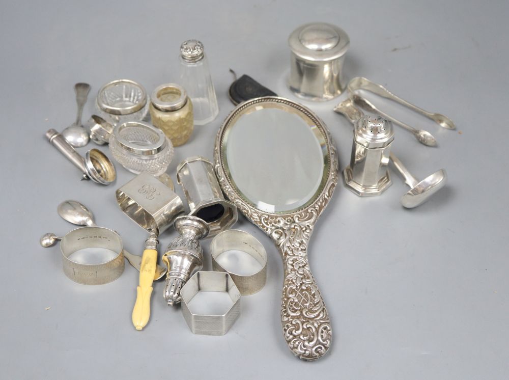 A collection of small silver including a hair tidy, four napkin rings, Scottish sauce ladle, condiments etc.